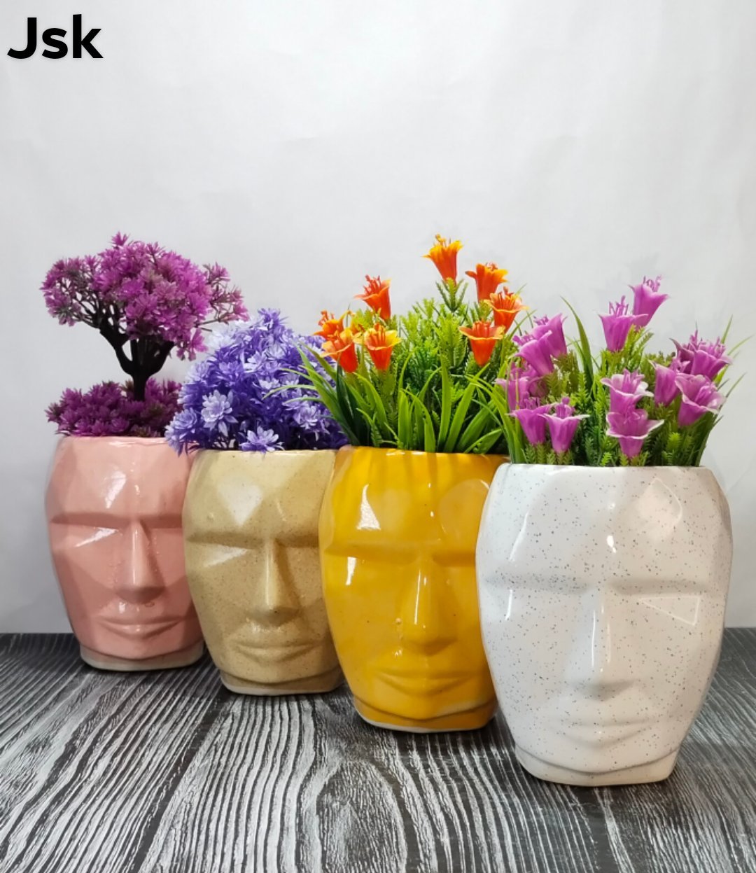 Collection of Ceramic Face Type Pots in a gallery layout