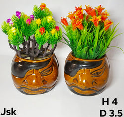 Collection of Ceramic Face Type Pots For Planters in a gallery layout