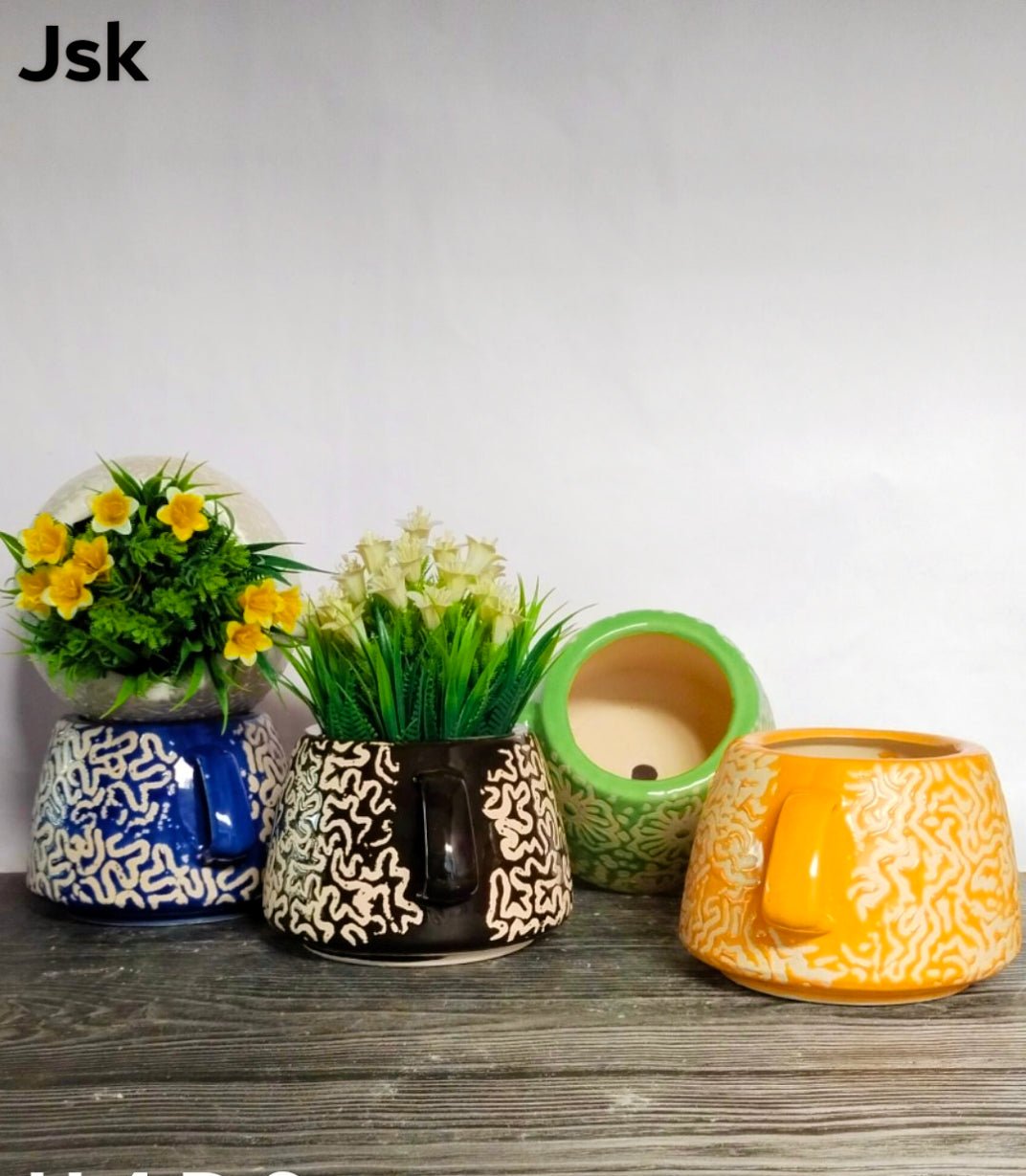 Collection of Ceramic Cup Pots in a gallery layout